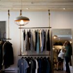 clothing boutique interior with hanging racks